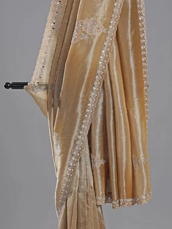Beige tissue silk saree with embellished elegance