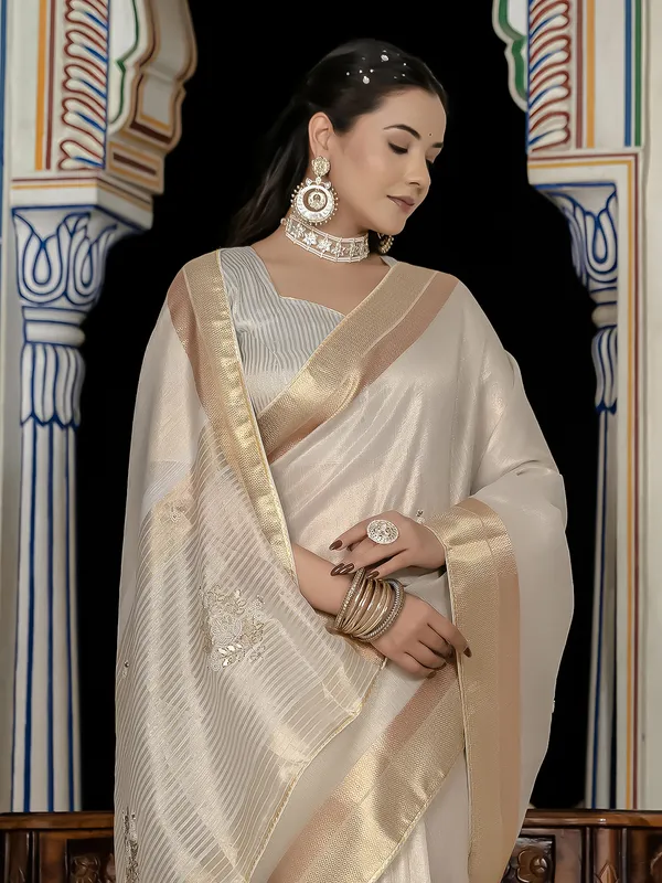 Beige tissue silk saree with gota and zari work