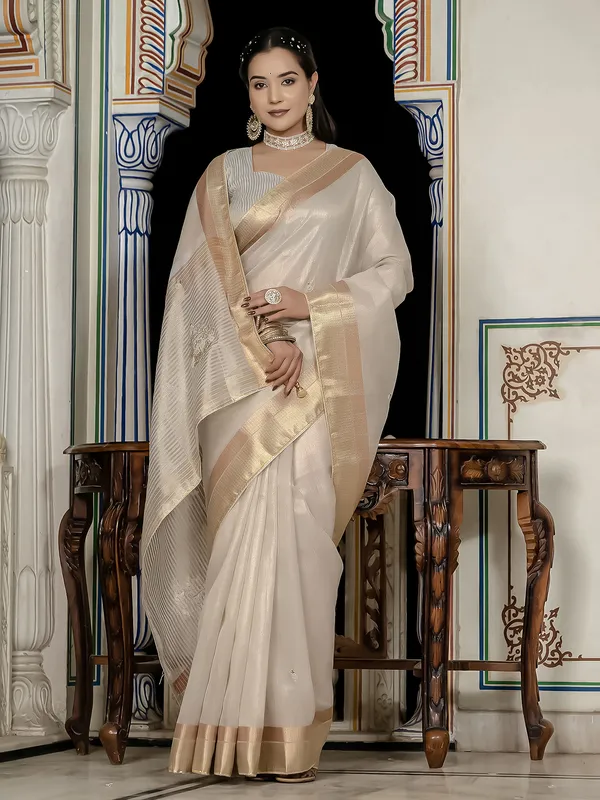 Beige tissue silk saree with gota and zari work