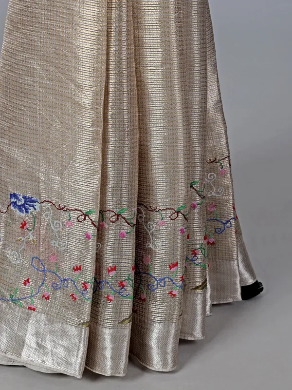 Beige tissue silk saree with thread and zari work