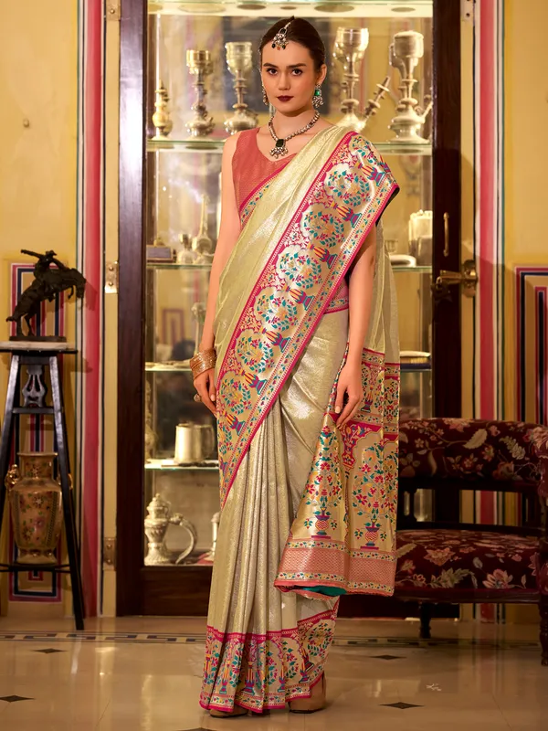 Beige tissue silk saree with zari and prints