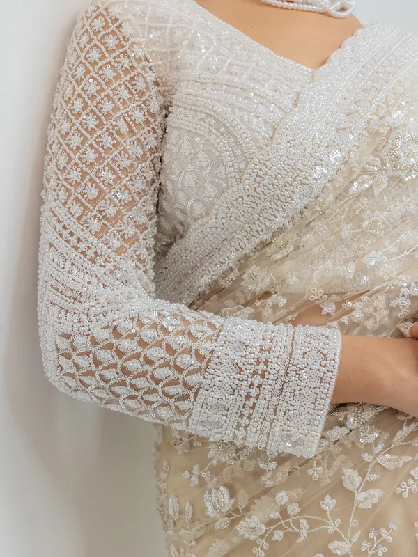 Beige wedding wear saree in soft net