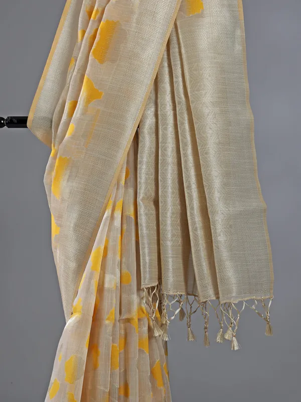 Beige yellow printed zari semi cotton saree