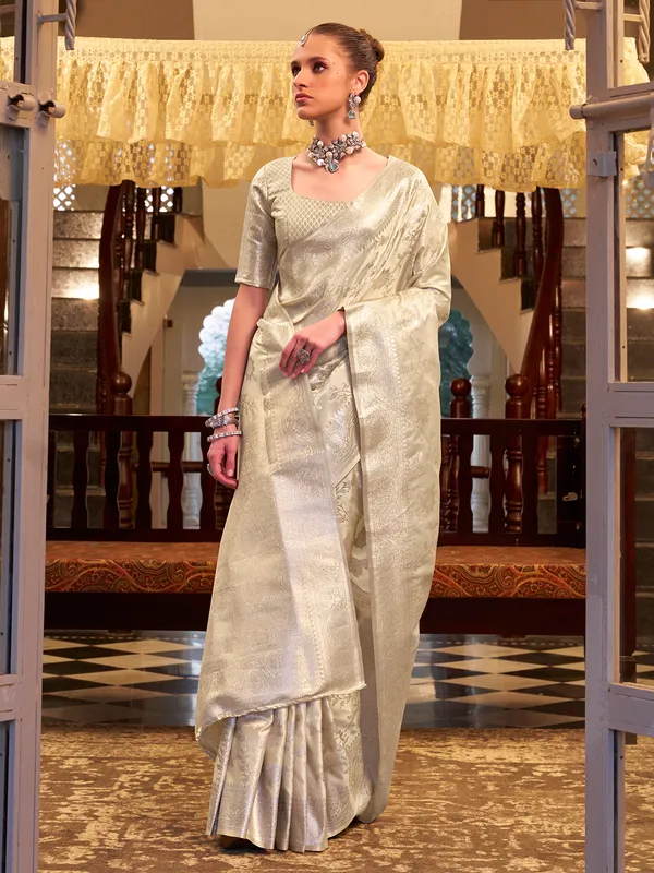 Beige zari worked saree in satin silk