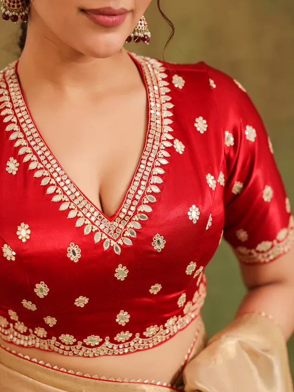 Beige zari worked silk saree with maroon blouse