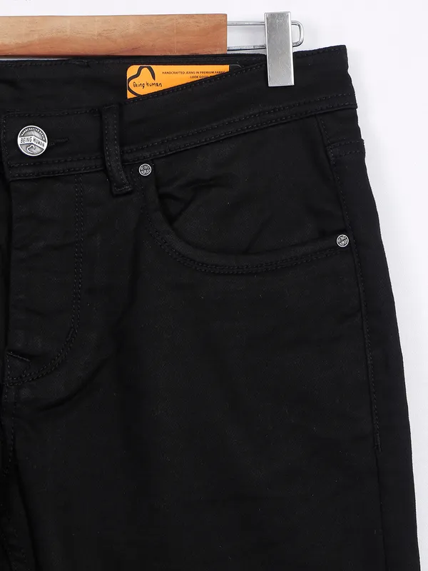 Being Human skinny fit black solid jeans