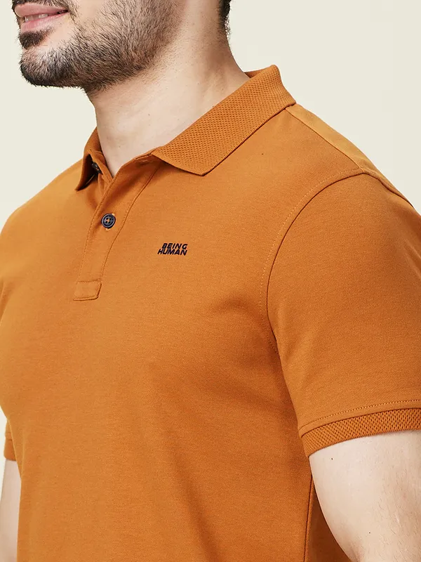 BEING HUMAN solid orange slim fit cotton polo t-shirt