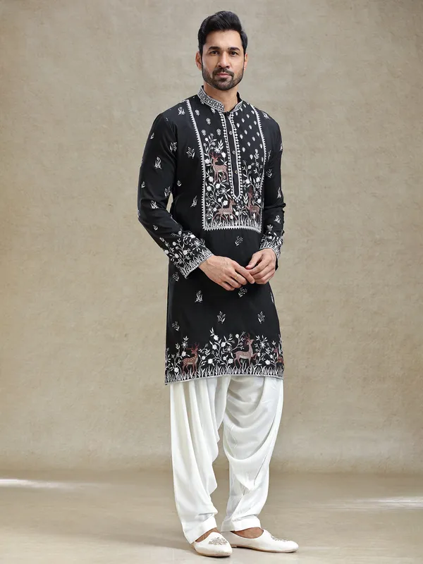 Black kurta salwar set in unique embroidery pattern