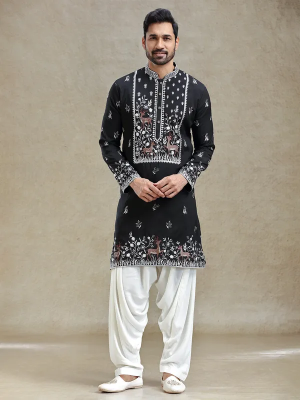 Black kurta salwar set in unique embroidery pattern