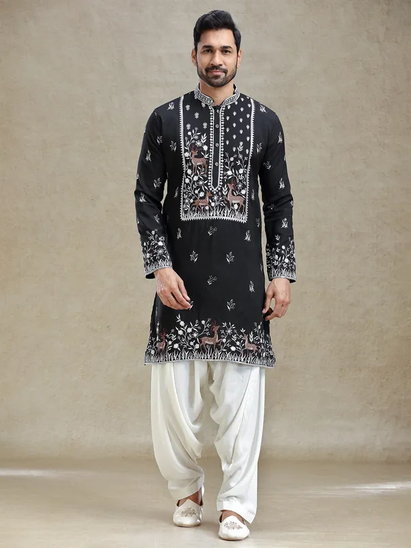 Black kurta salwar set in unique embroidery pattern