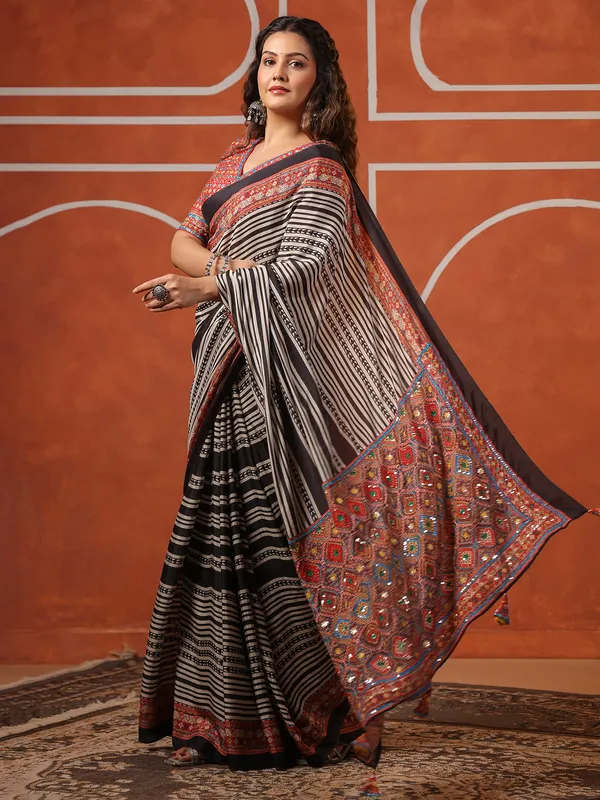 Black muslin printed saree with ready made blouse