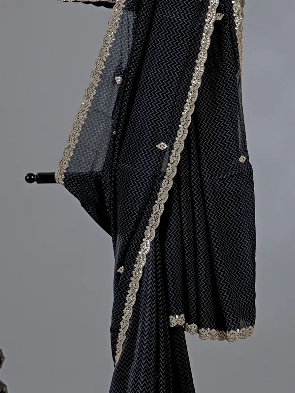 Black muslin silk printed saree with festive detailing