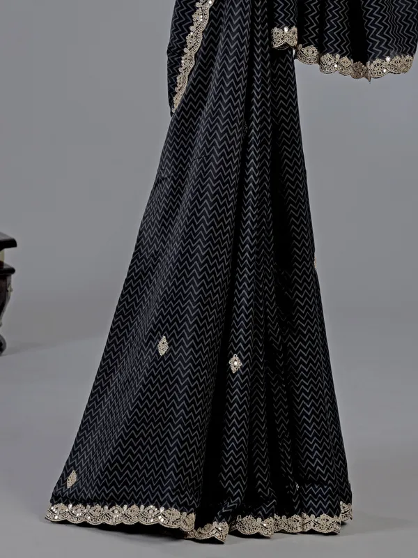 Black muslin silk printed saree with festive detailing