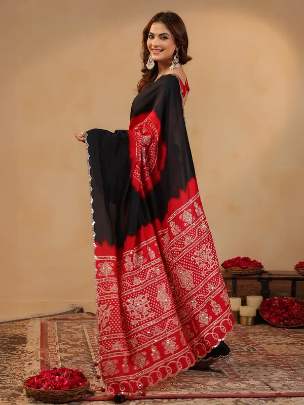 Black printed silk saree with aabla accents
