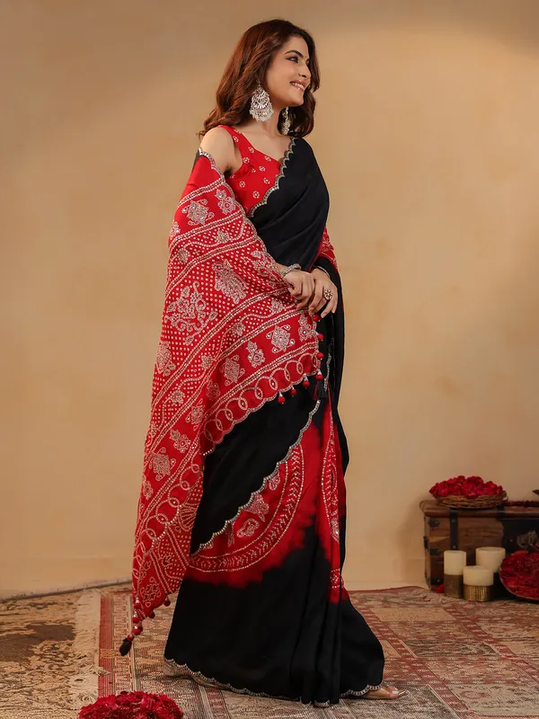 Black printed silk saree with aabla accents