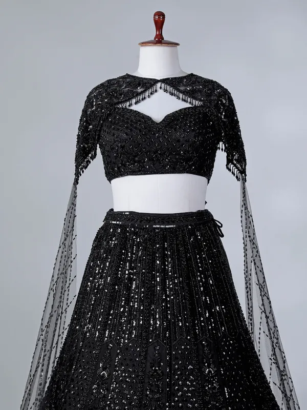 Black silk cape style cutdana lehenga choli