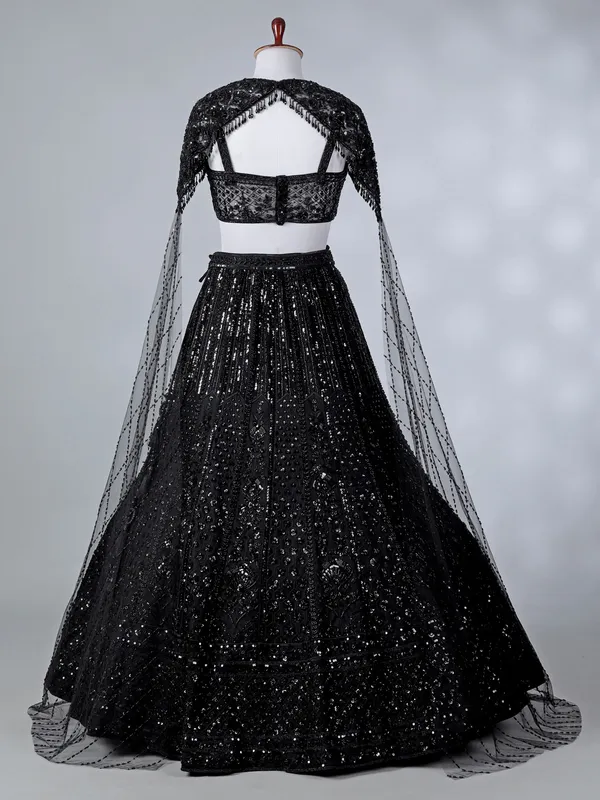 Black silk cape style cutdana lehenga choli