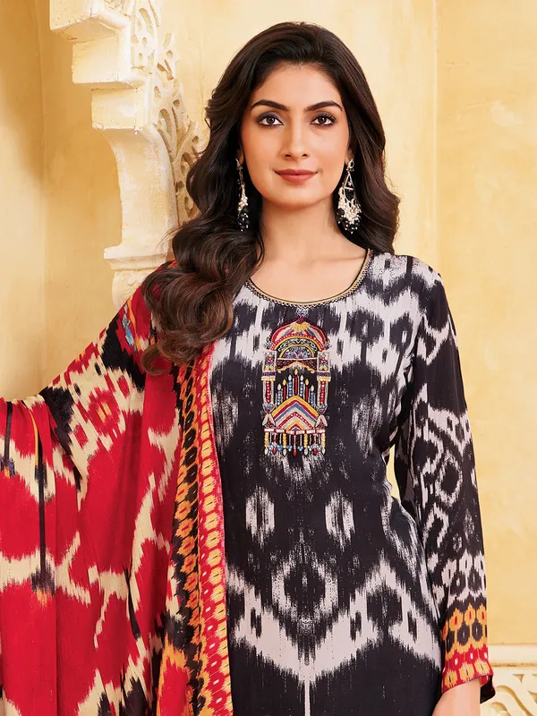 Black silk printed straight cut salwar suit with contrast dupatta