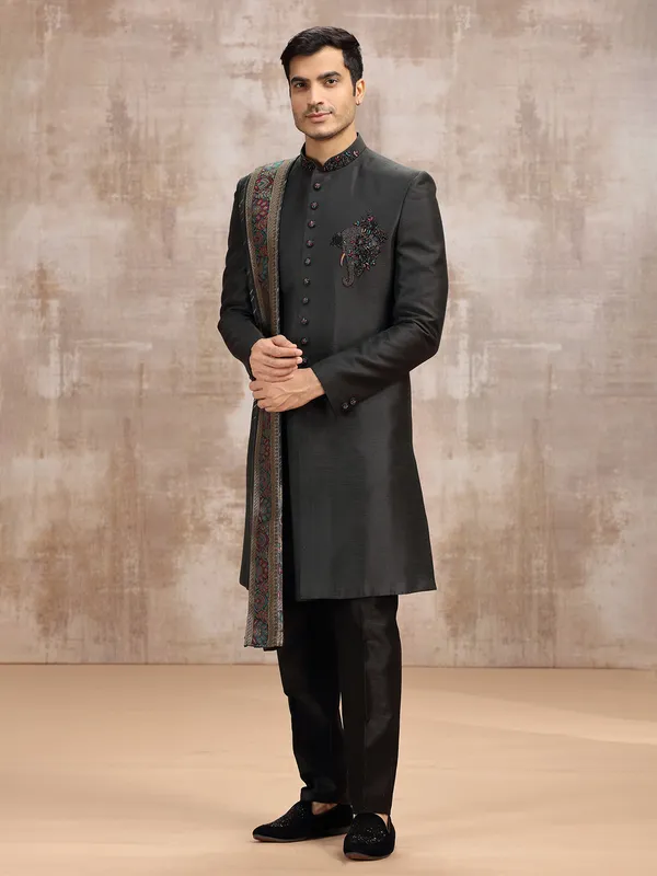 Black silk sherwani styled with dupatta