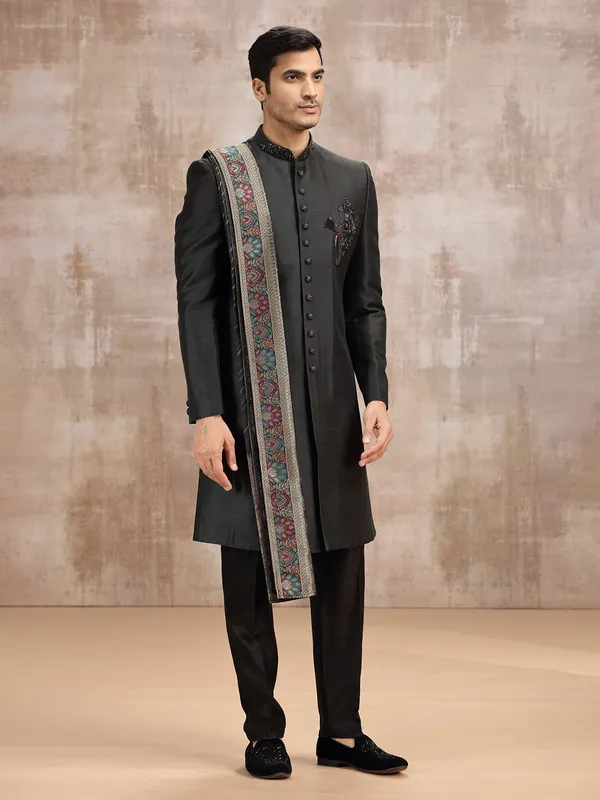 Black silk sherwani styled with dupatta