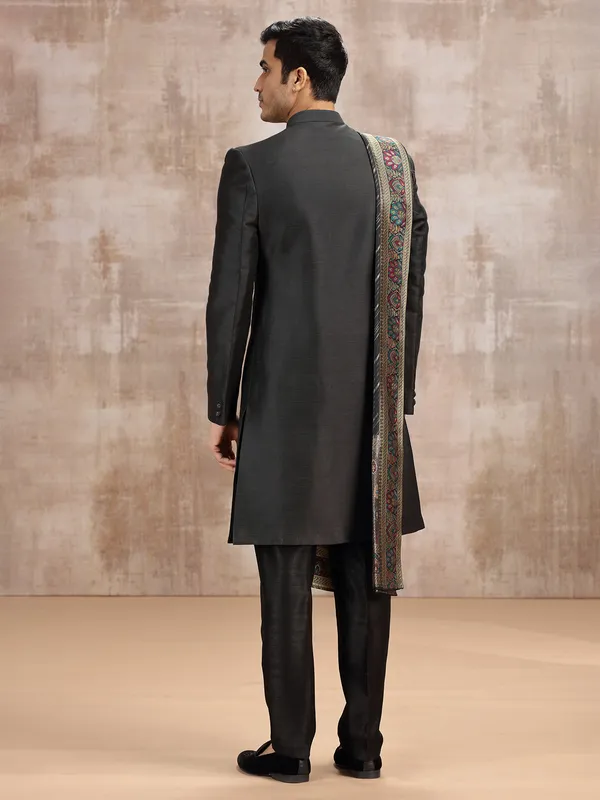 Black silk sherwani styled with dupatta