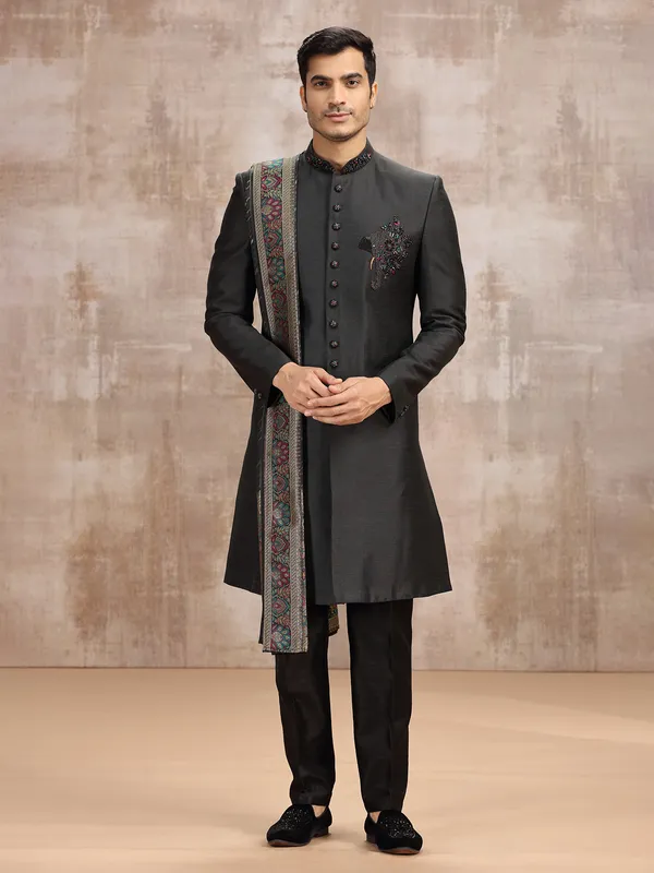 Black silk sherwani styled with dupatta