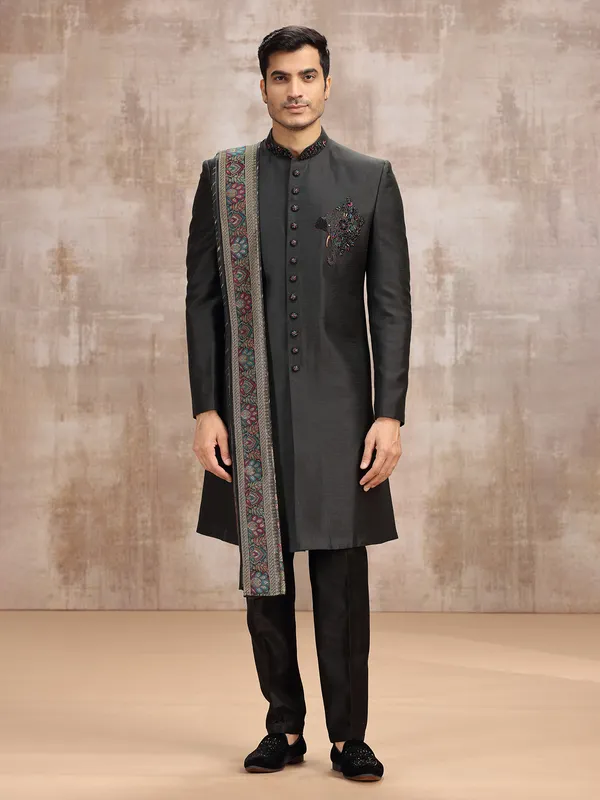 Black silk sherwani styled with dupatta