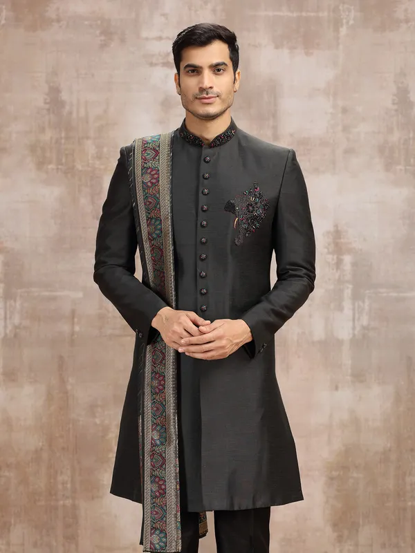 Black silk sherwani styled with dupatta
