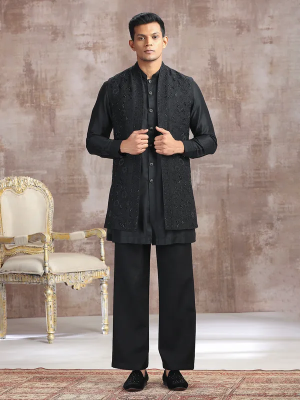 Black silk waistcoat set with thread work