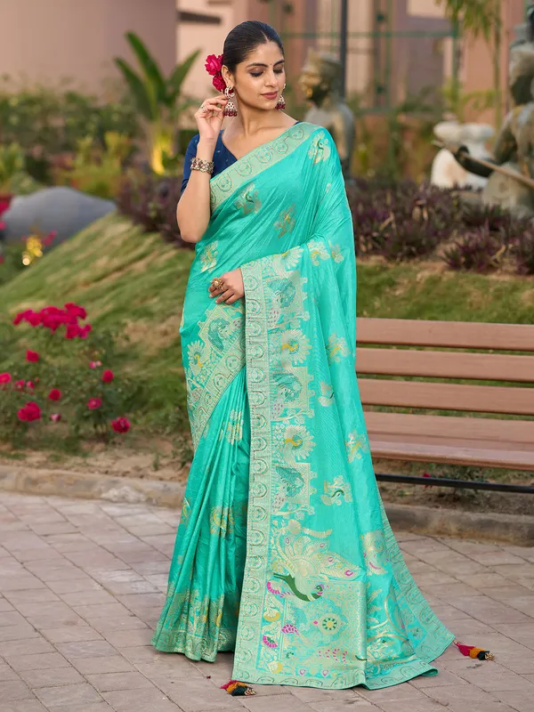 Blue dola silk saree with stone zari weaving