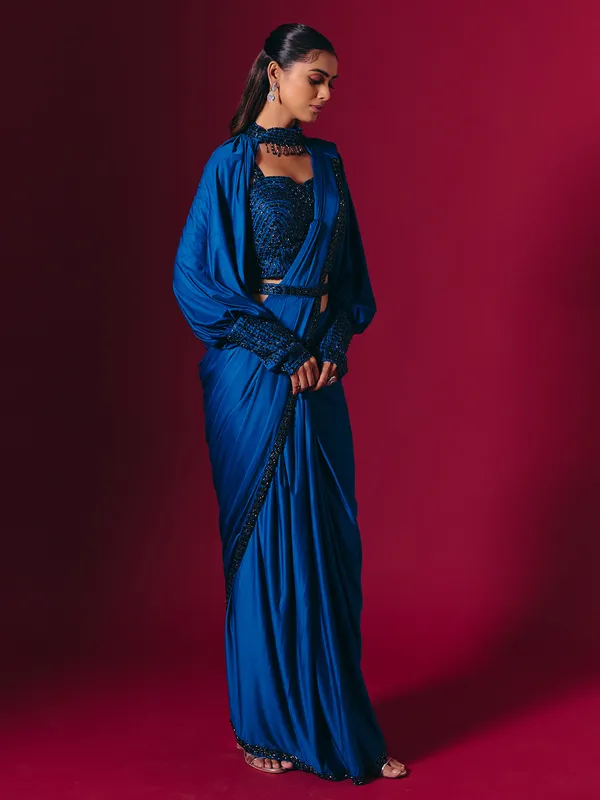 Blue lycra saree adorned with cutdana and pearls work