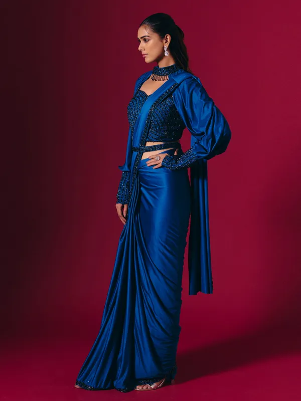 Blue lycra saree adorned with cutdana and pearls work