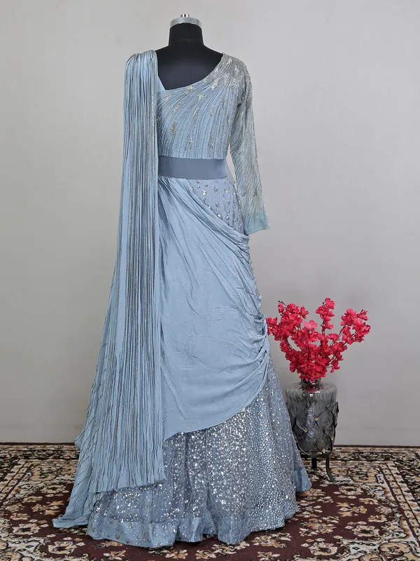 Blue net floor length gown with draped odhani pattern