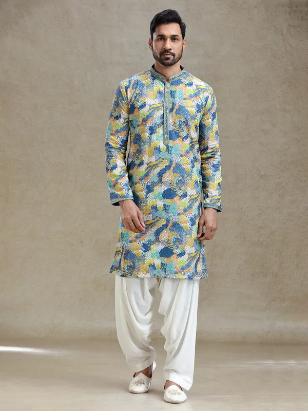 Blue printed kurta salwar set in textured embroidery