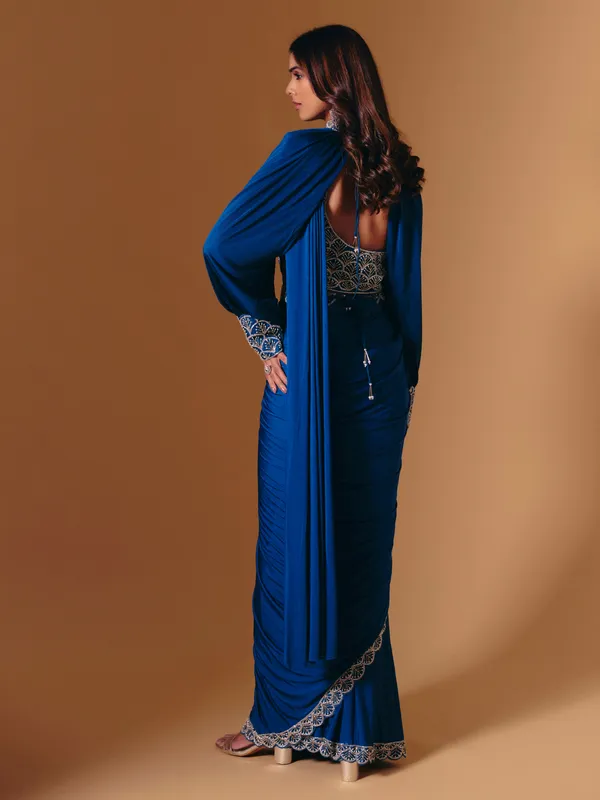 Blue satin saree with refined cutdana and pearl work