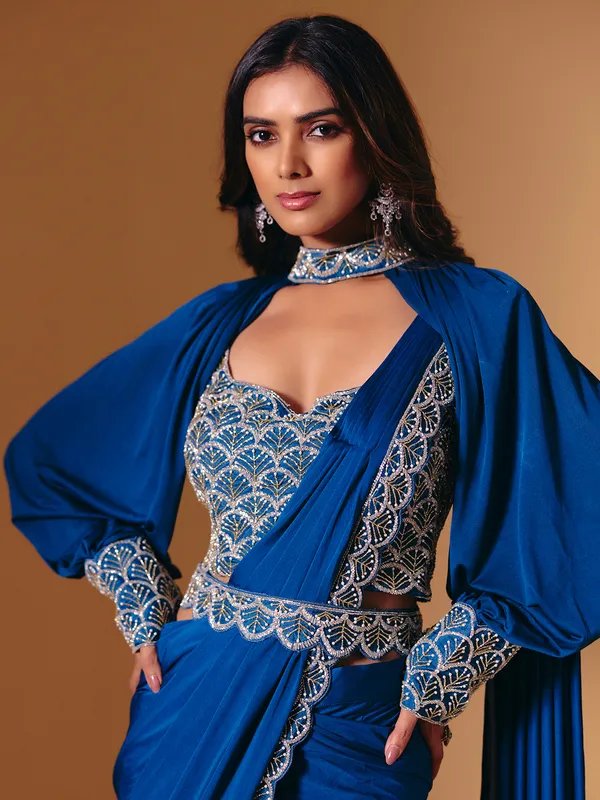 Blue satin saree with refined cutdana and pearl work