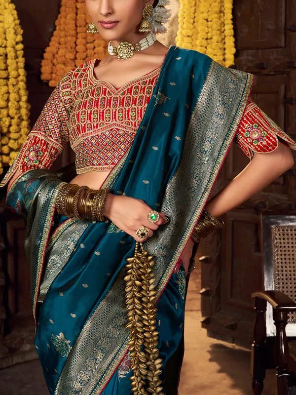 Blue silk saree with rich embellished blouse