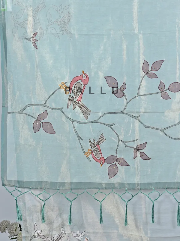 Blue tissue saree with printed detailing