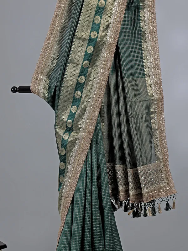 Bottle green dola silk saree with zari weaving