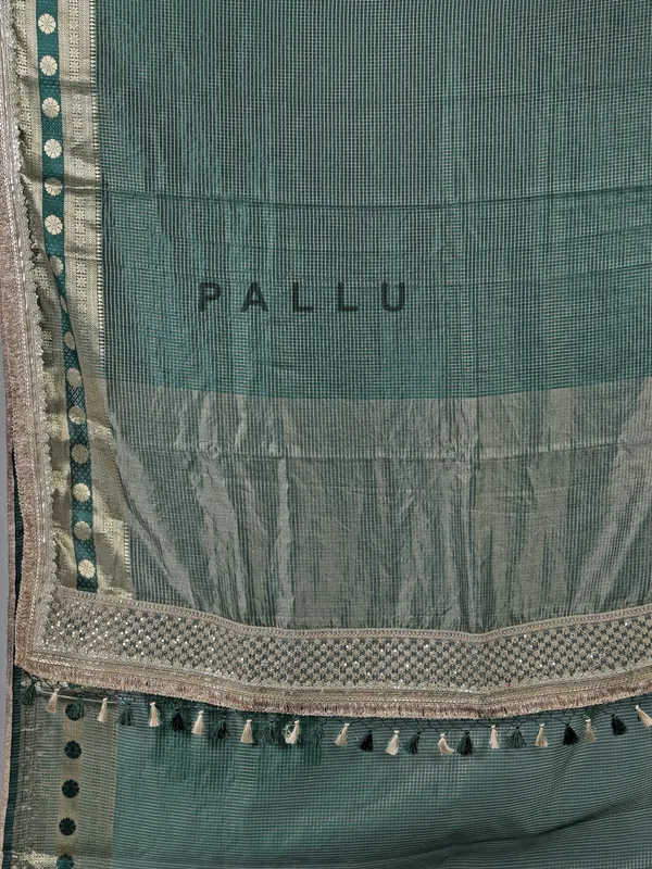 Bottle green dola silk saree with zari weaving