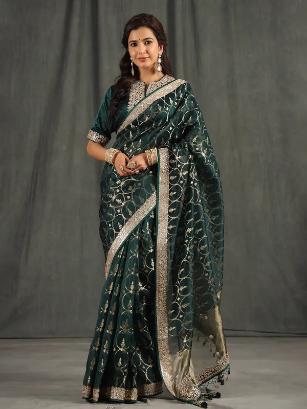 Bottle green organza saree for wedding