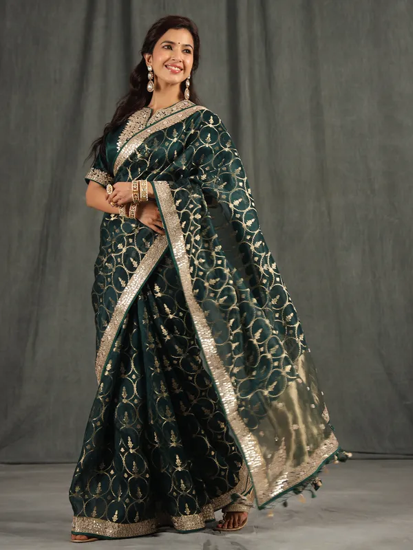 Bottle green organza saree for wedding