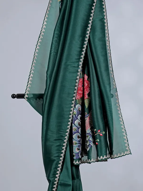 Bottle green tissue silk saree with peacock work