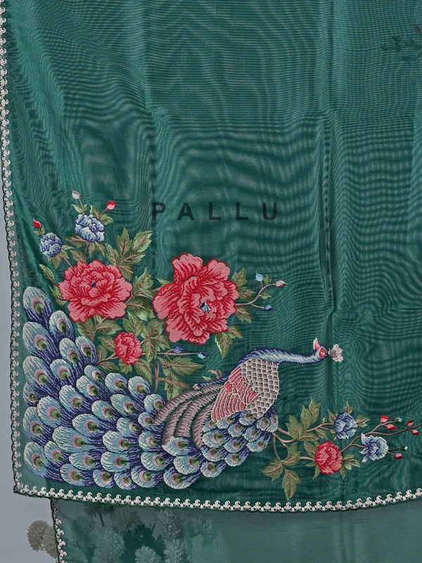 Bottle green tissue silk saree with peacock work