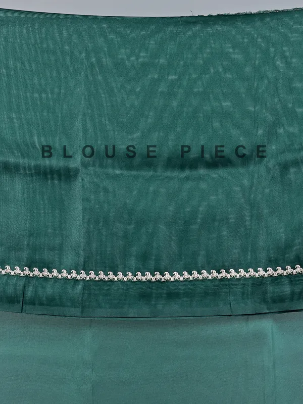 Bottle green tissue silk saree with peacock work