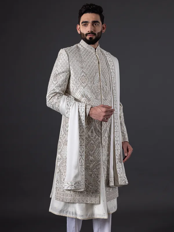 Breath taking pearl white sherwani in silk for groom