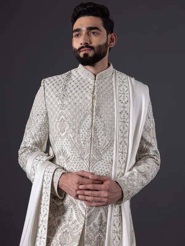Breath taking pearl white sherwani in silk for groom