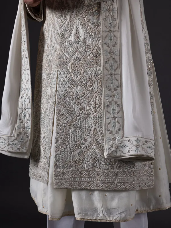 Breath taking pearl white sherwani in silk for groom