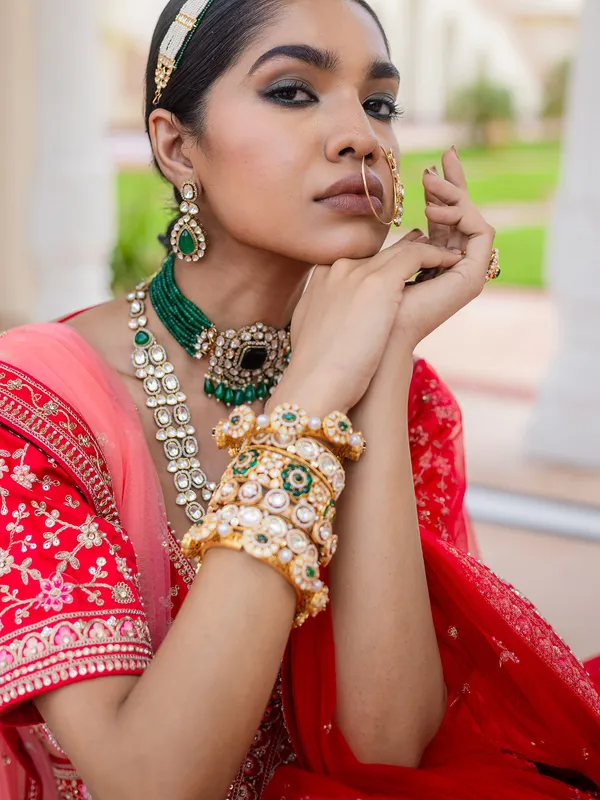 Bridal red silk lehenga choli with rich embellishment