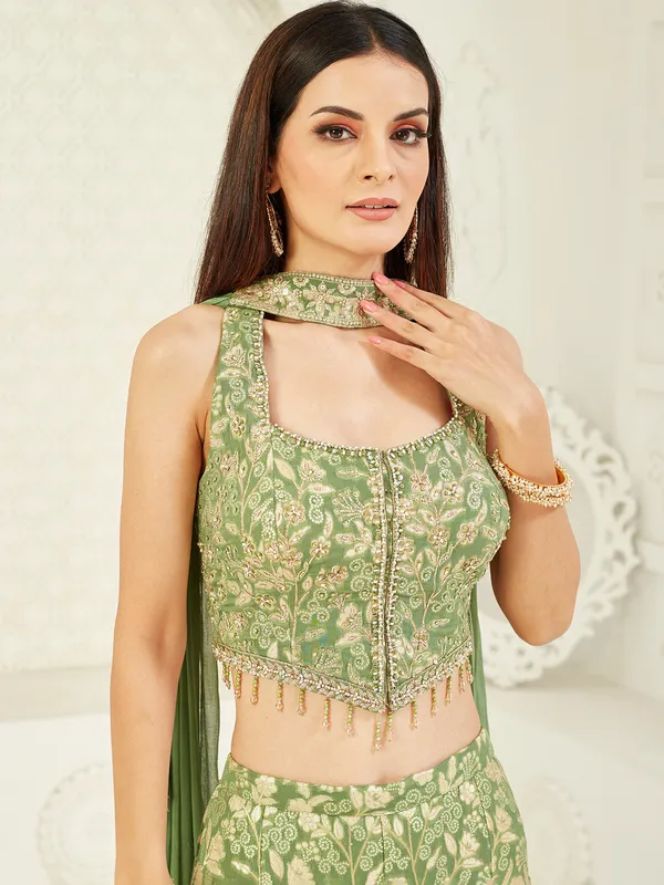 Bright green sleeveless silk palazzo suit with stone work